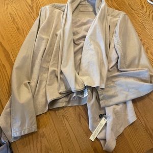 Cream color crop faux leather jacket.